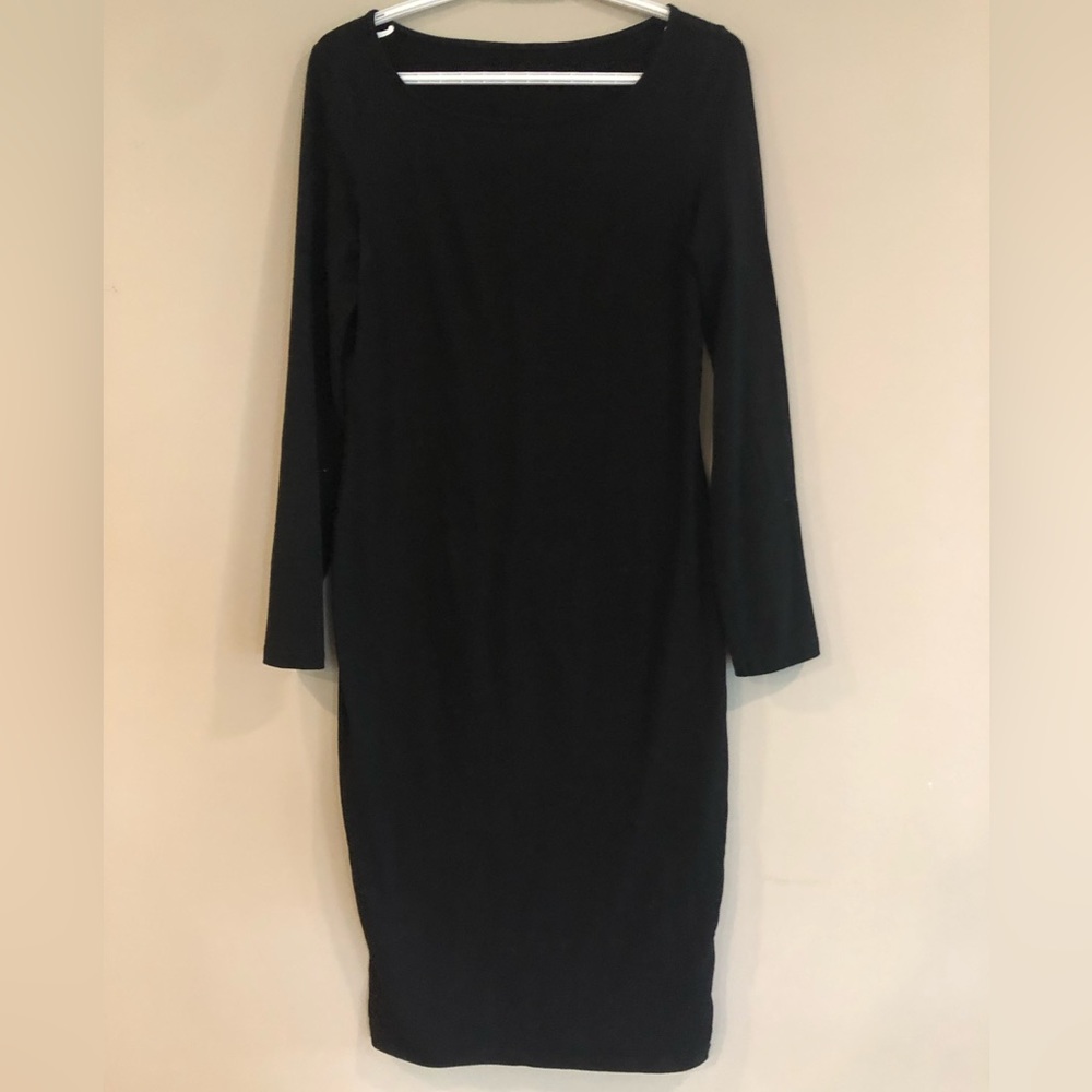 Shin length form fitting long sleeve black dress